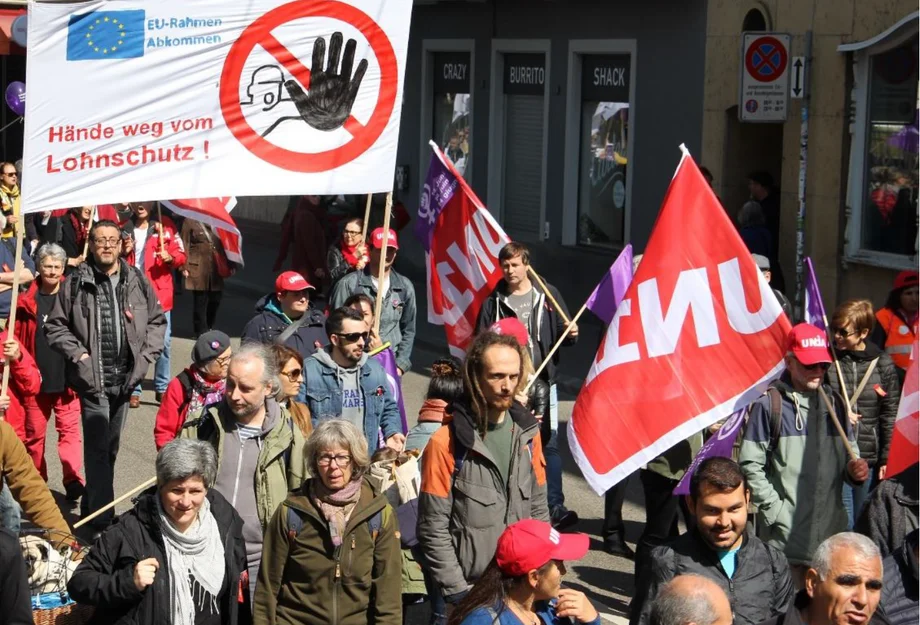 Titre de la brochure L’attaque des employeurs du Sud de l'Allemagne contre la protection des salaires en Suisse - Brochure d'Unia